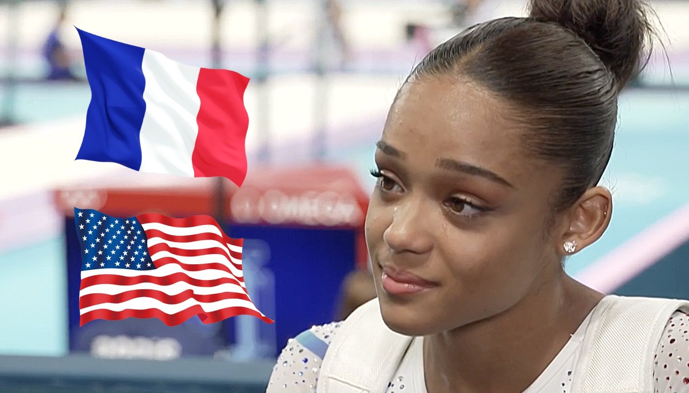 La gymnaste Mélanie de Jesus dos Santos, ici accompagnée des drapeaux de la France et des États-Unis